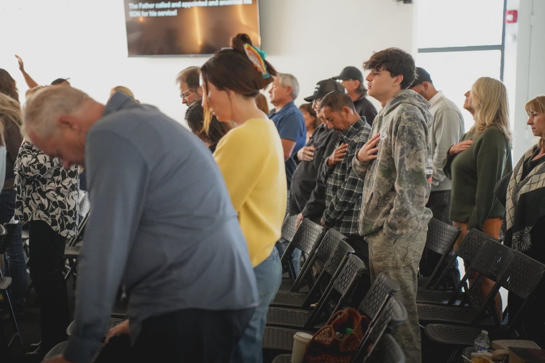People at Radiant bowing their heads in prayer